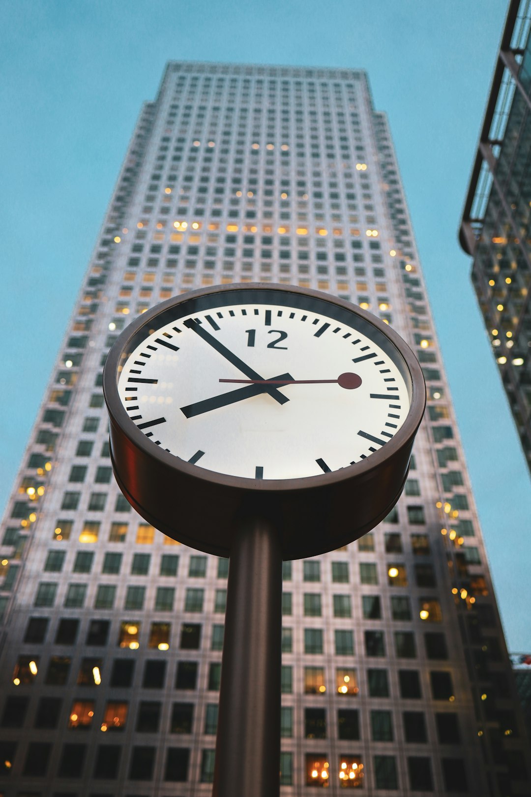 white and black analog clock at 10 00