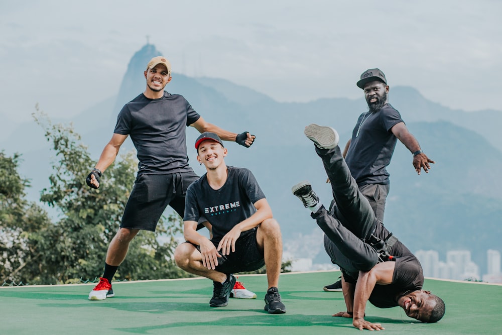 man in gray crew neck t-shirt and black shorts playing soccer during daytime