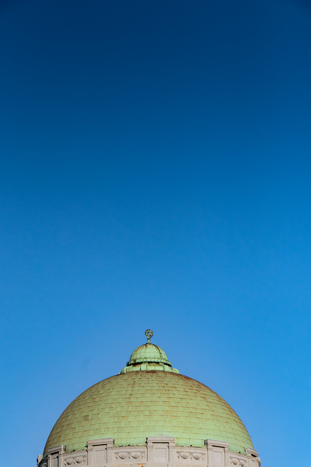 brown and white dome building under blue sky during daytime