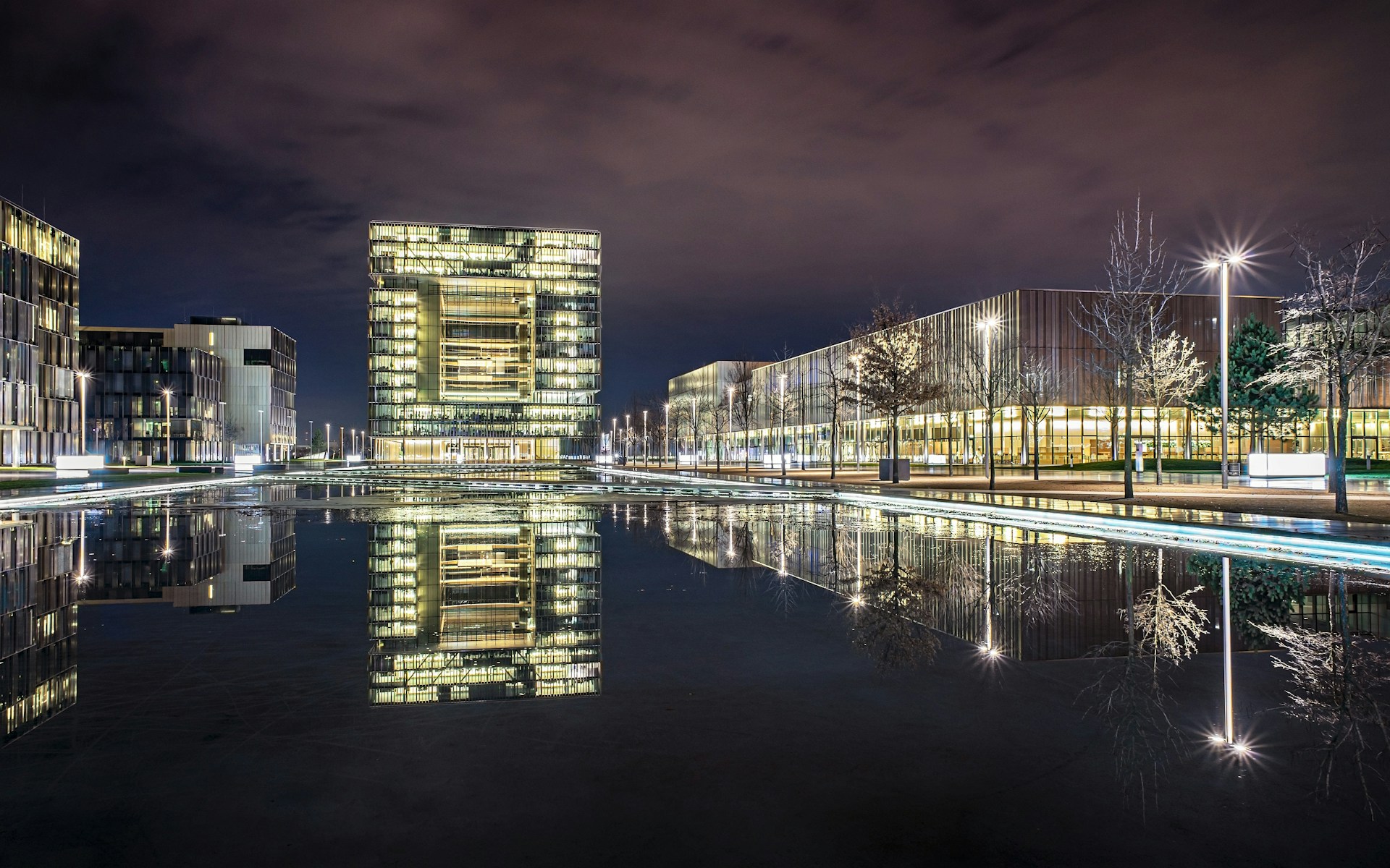 body of water near building during night time
