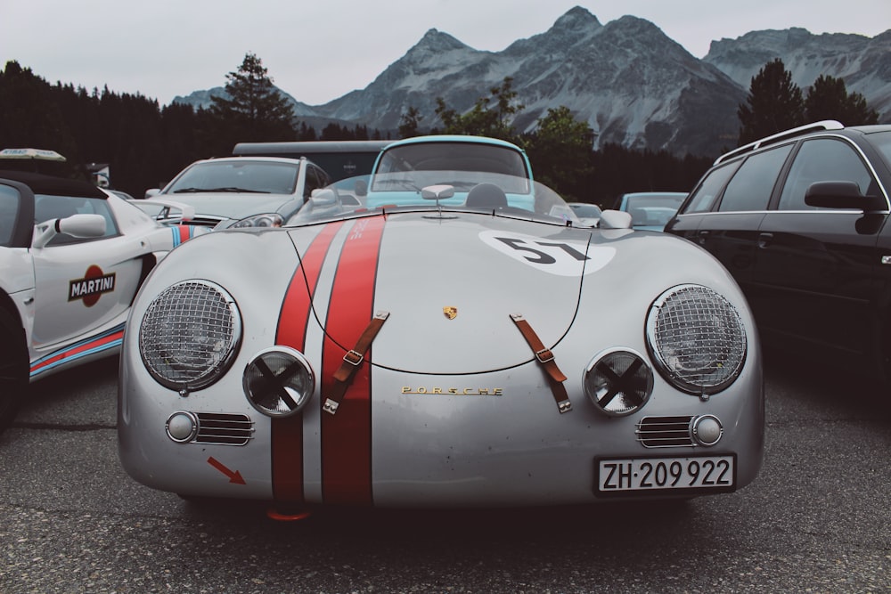 white and black porsche 911 on road during daytime