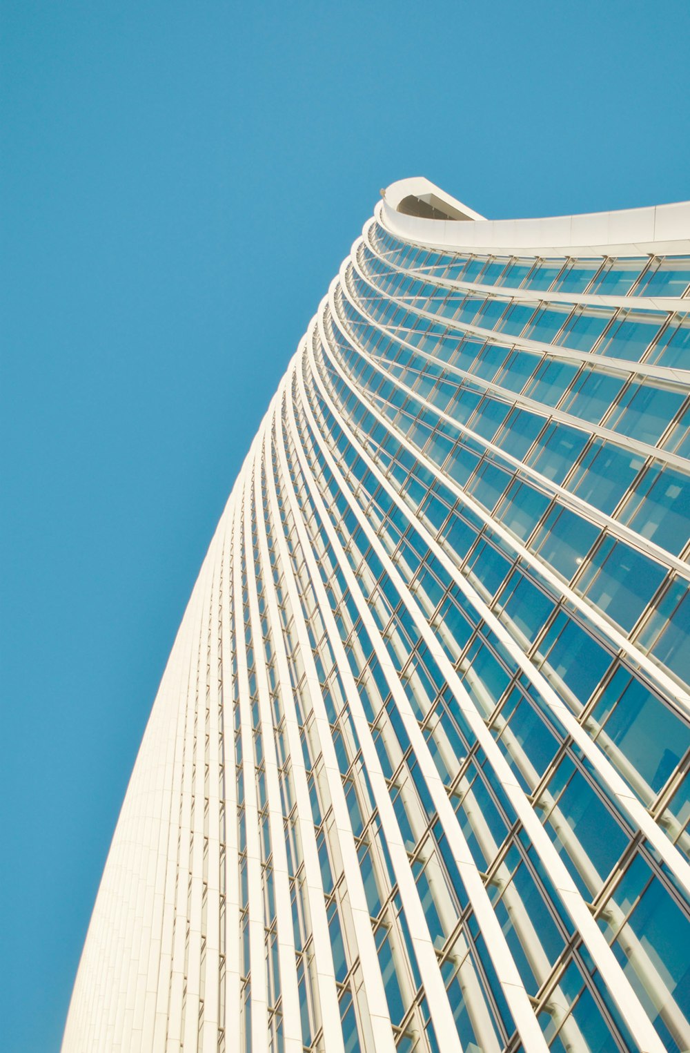 white concrete building under blue sky during daytime