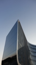 blue glass walled high rise building