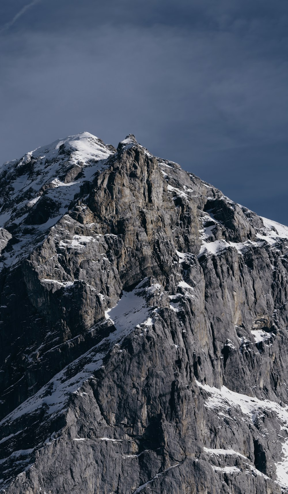 snow covered mountain under blue sky during daytime