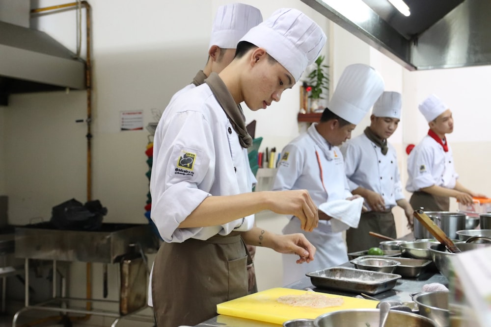 chef in white chef uniform cooking