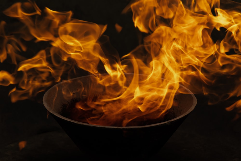 fire in black ceramic bowl
