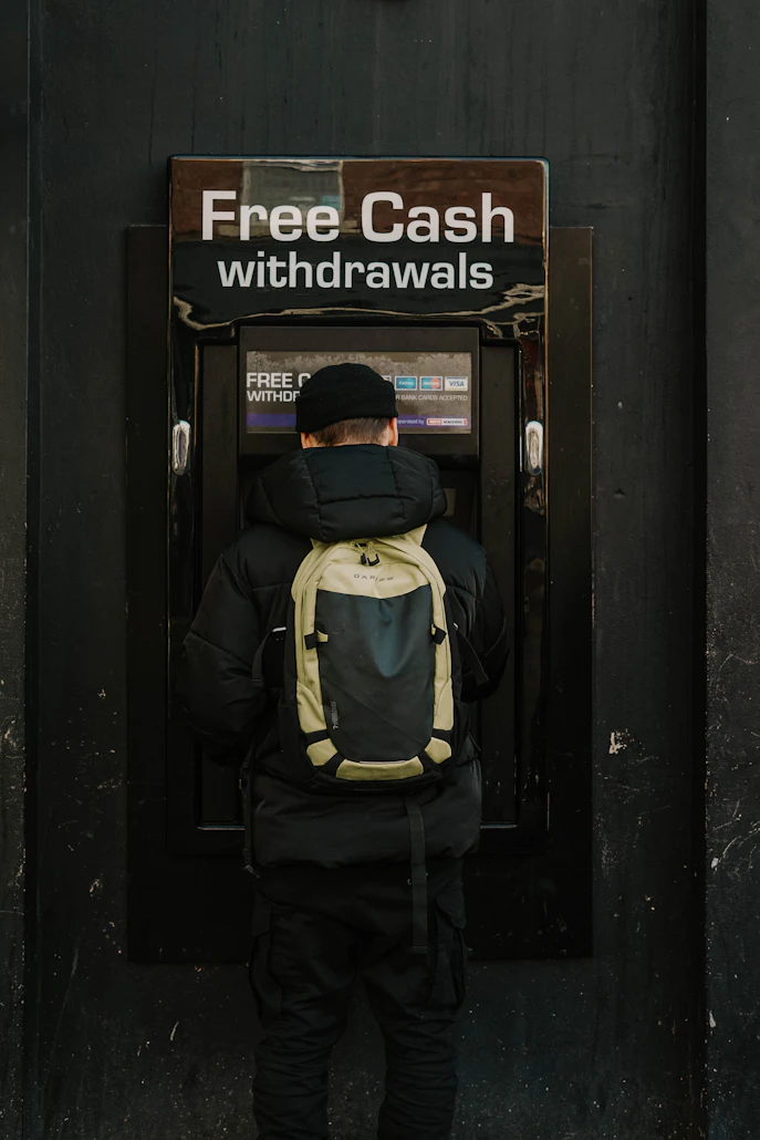 Person transferring money between bank accounts using online banking