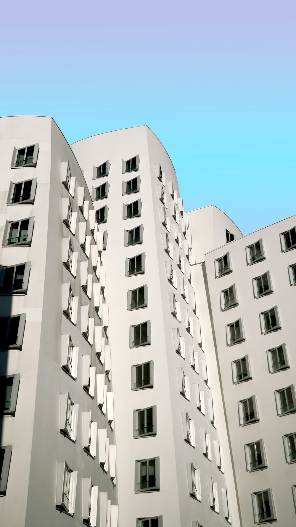 white concrete building under blue sky during daytime