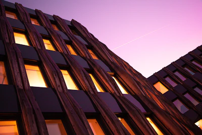 Contemporary architectural facade of a commercial building at dusk.