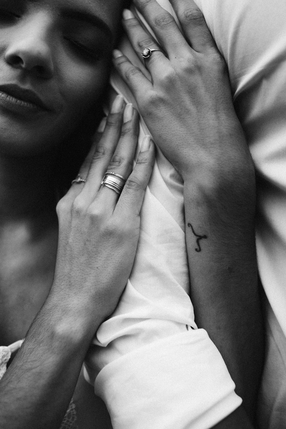 grayscale photo of woman wearing ring