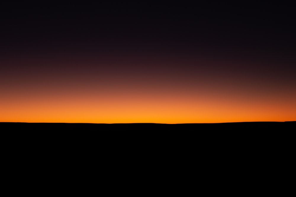 orange and black sky during sunset