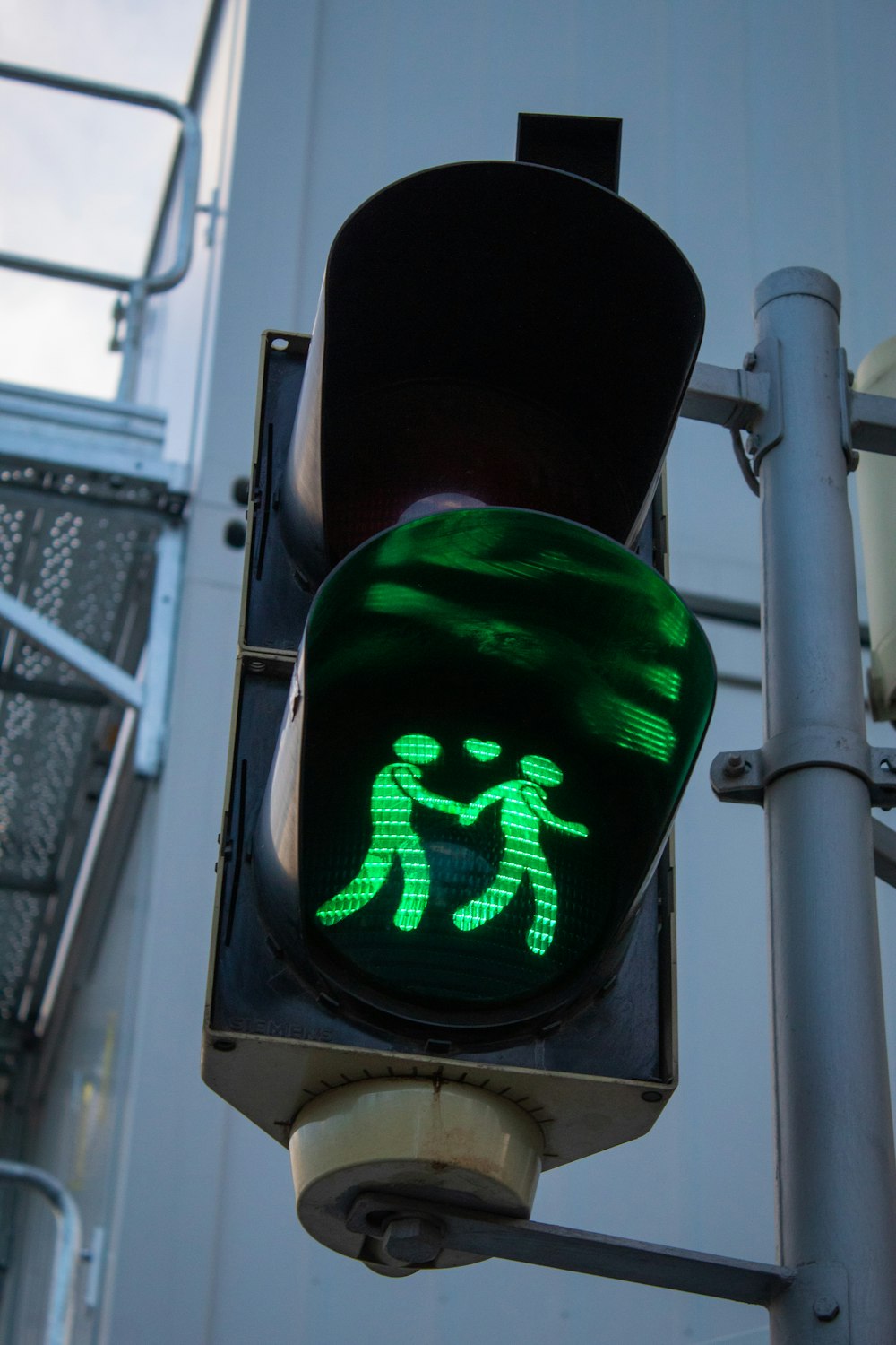 black traffic light with green light