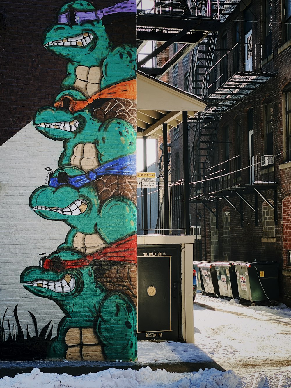 blue and black graffiti on wall