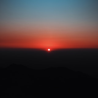 silhouette of mountain during sunset