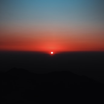 silhouette of mountain during sunset