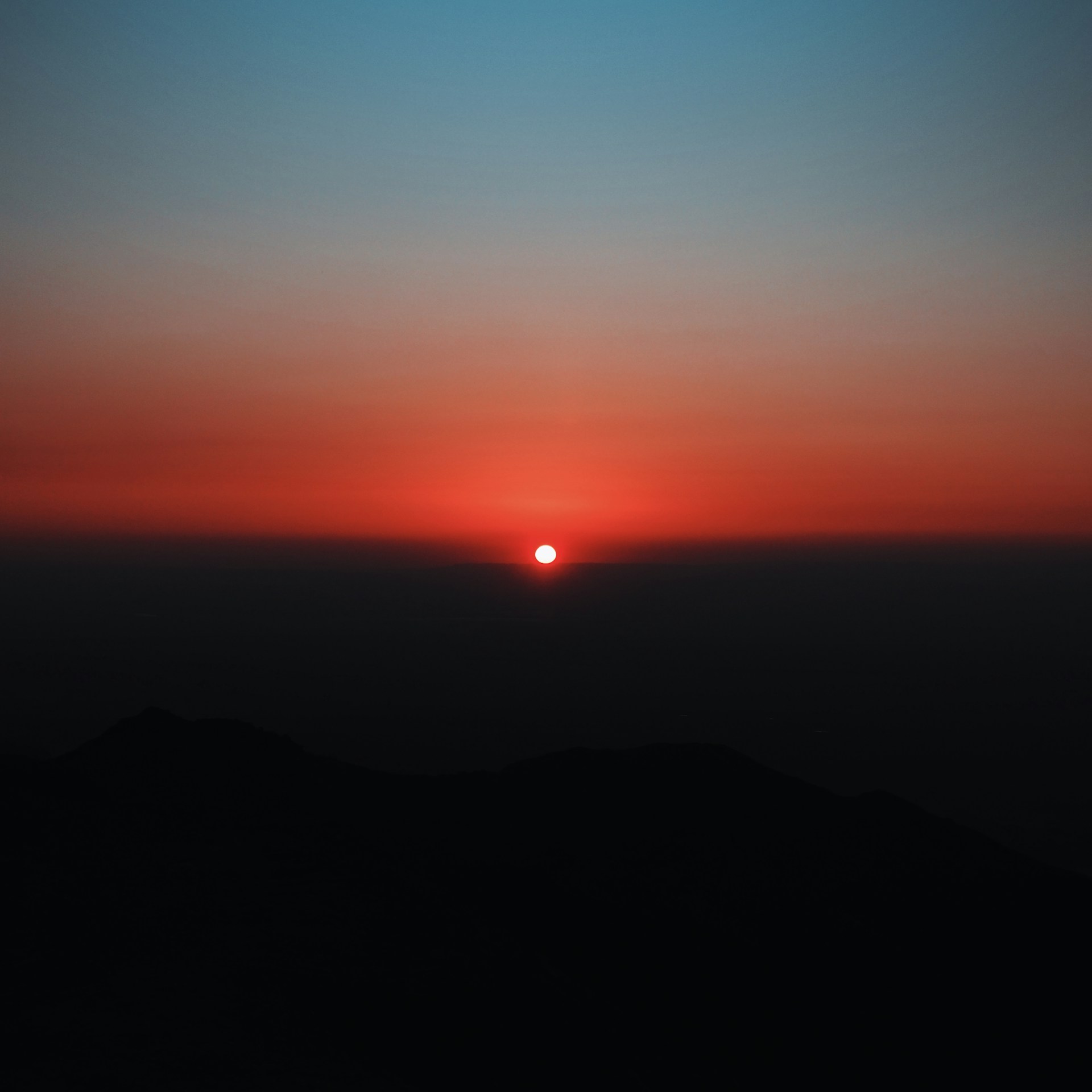 silhouette of mountain during sunset
