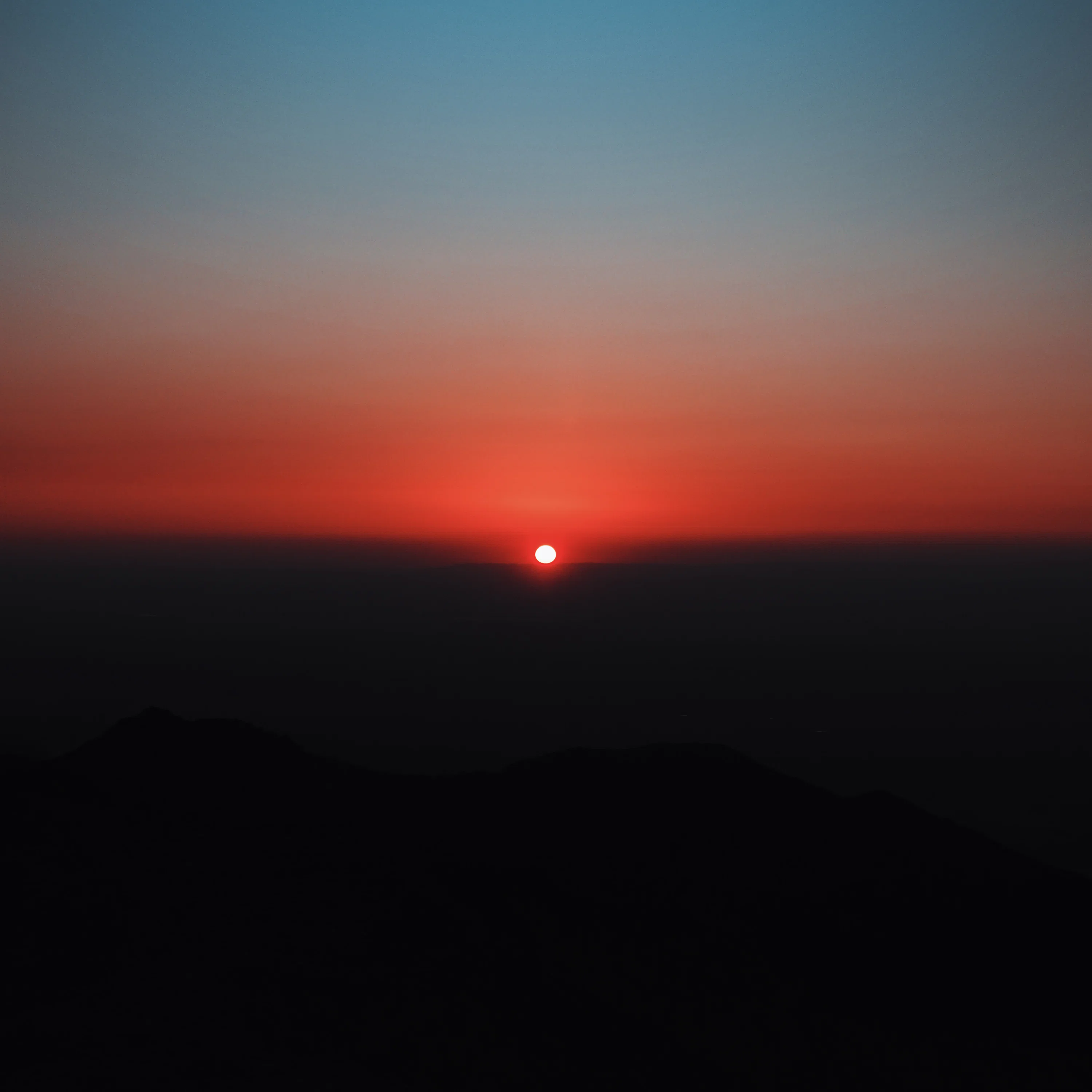 silhouette of mountain during sunset