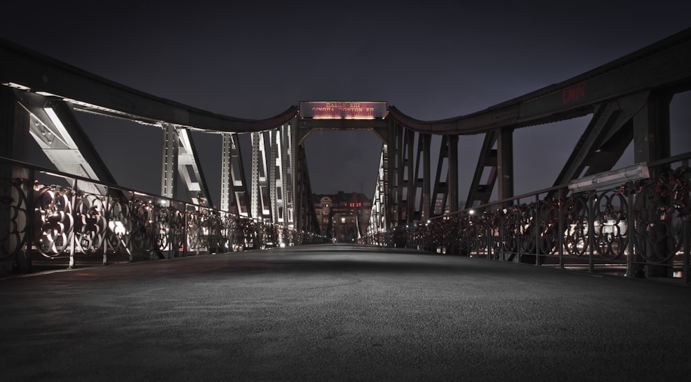 red and white bridge during night time