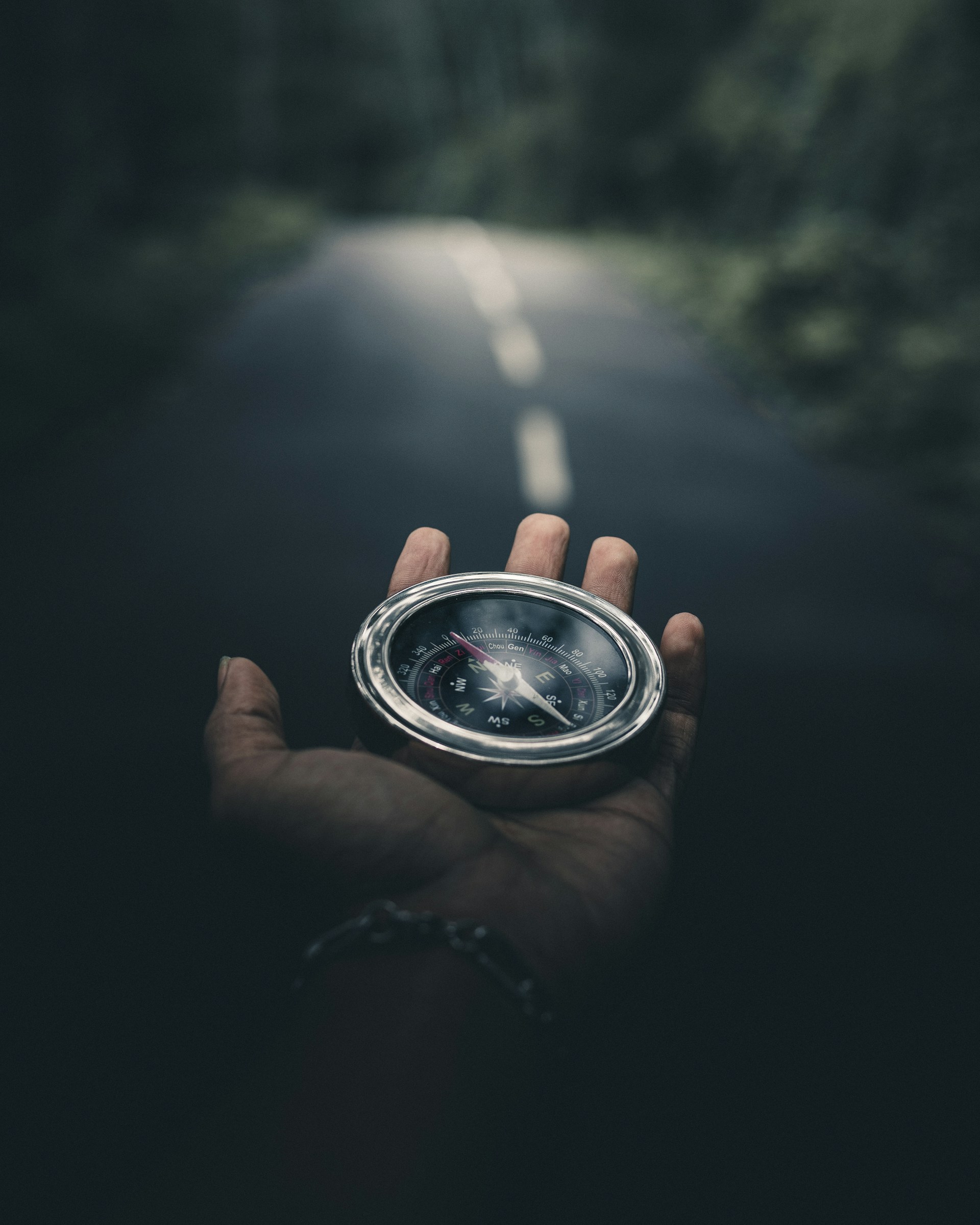 person holding silver round container