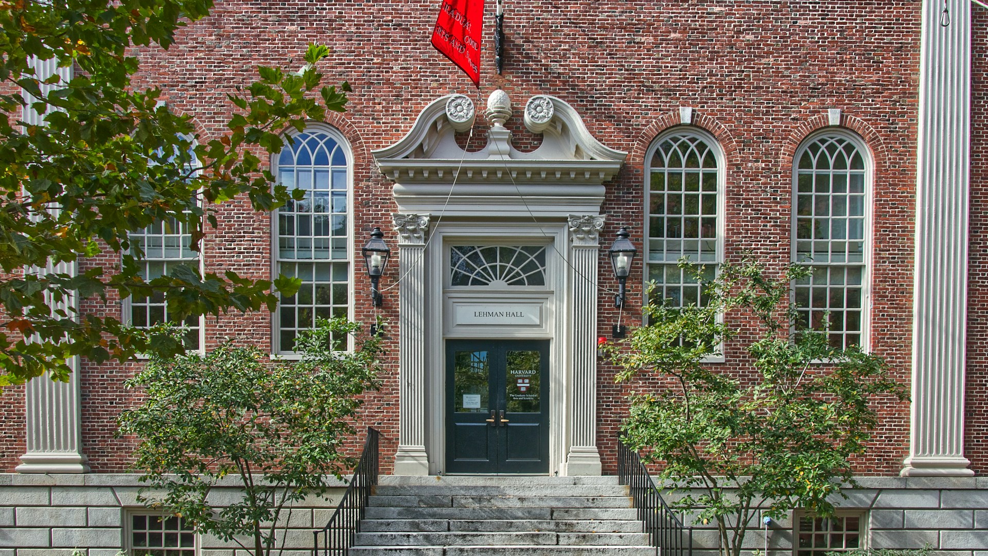brown brick building with green plants