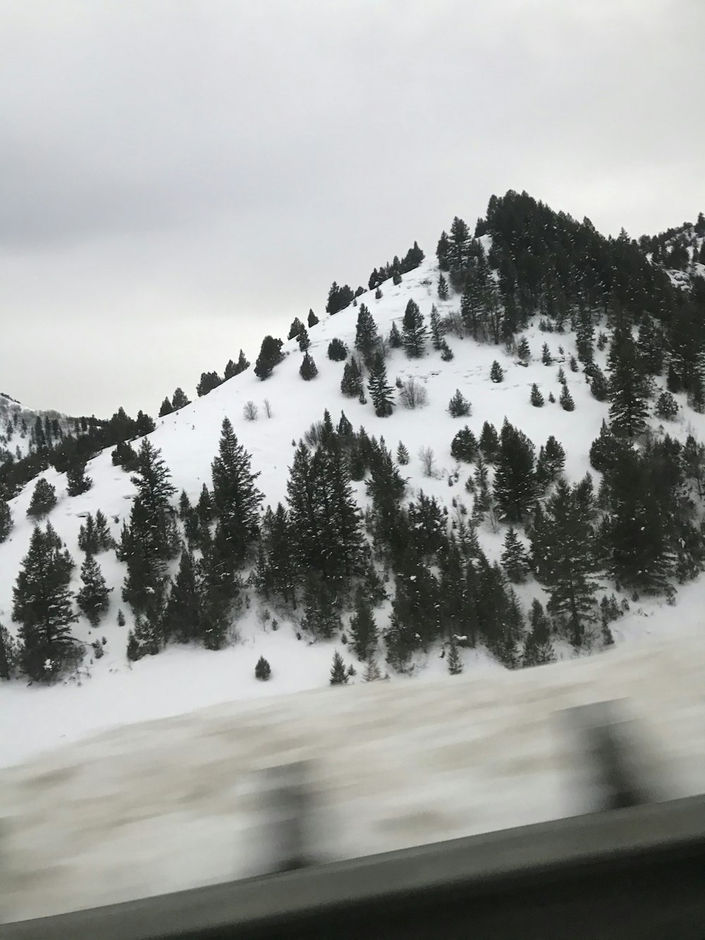 snow covered mountain during daytime