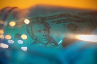 Illustration of a dollar bill on a calming blue background symbolizing easy cash access.