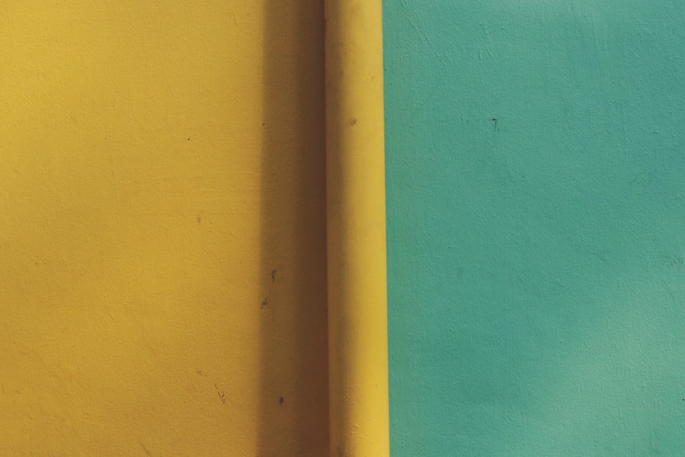 yellow painted wall with light bulb