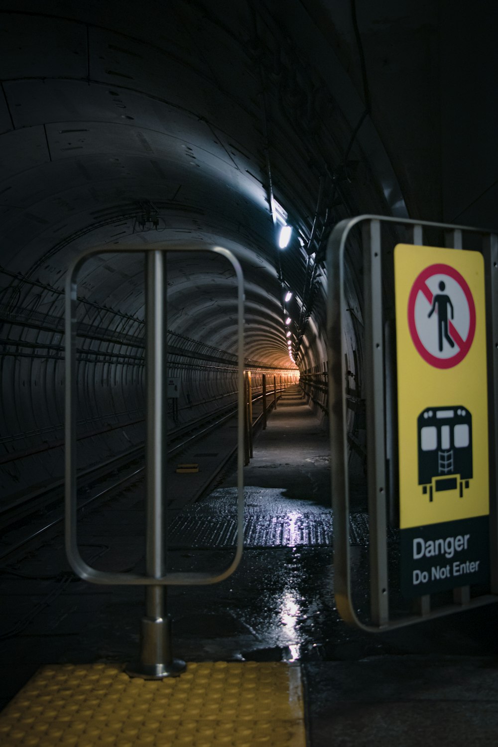 yellow and black train in train station