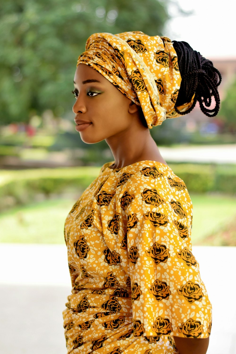 woman in yellow and white floral hijab