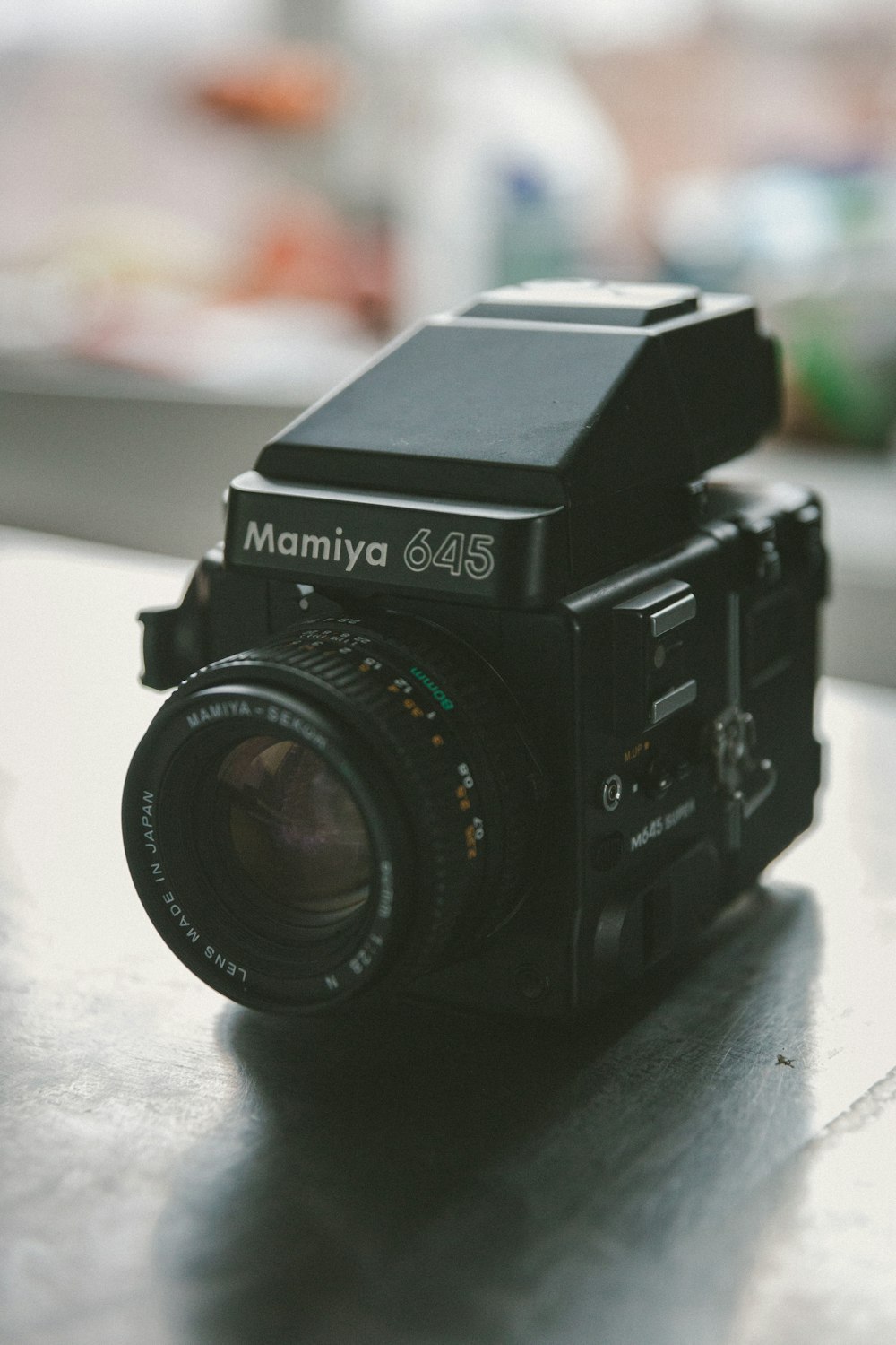 black nikon camera on white table