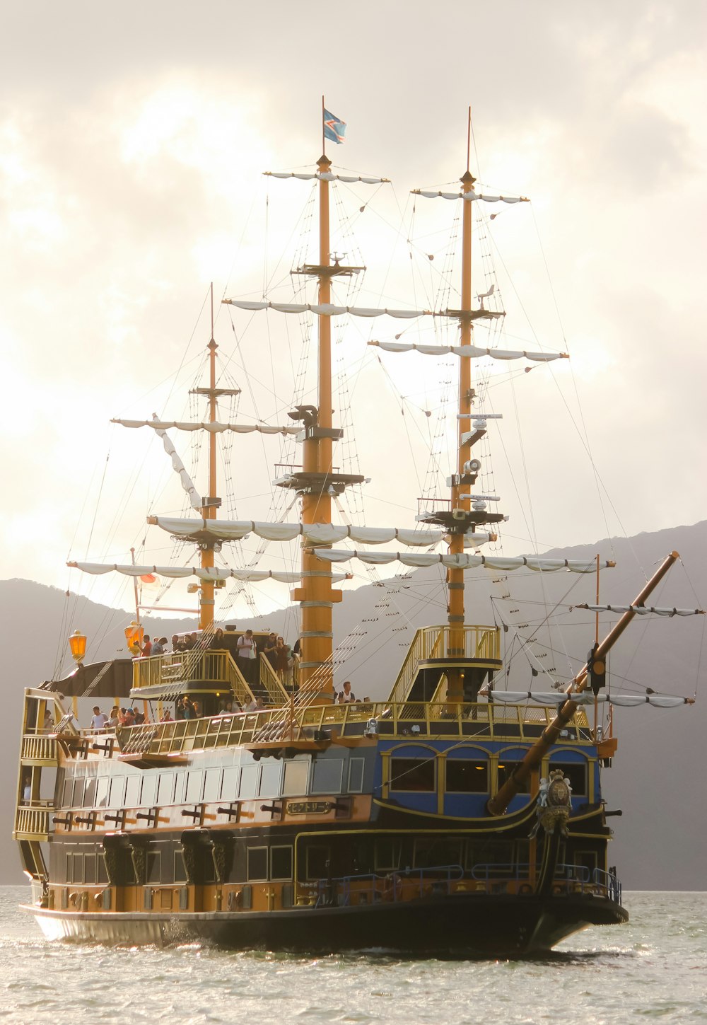 white and brown ship on sea during daytime