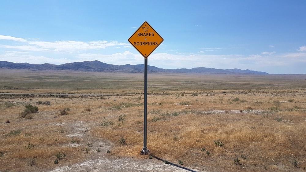 black and red road sign