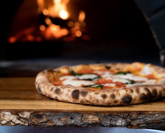 pizza on brown wooden table