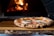 pizza on brown wooden table