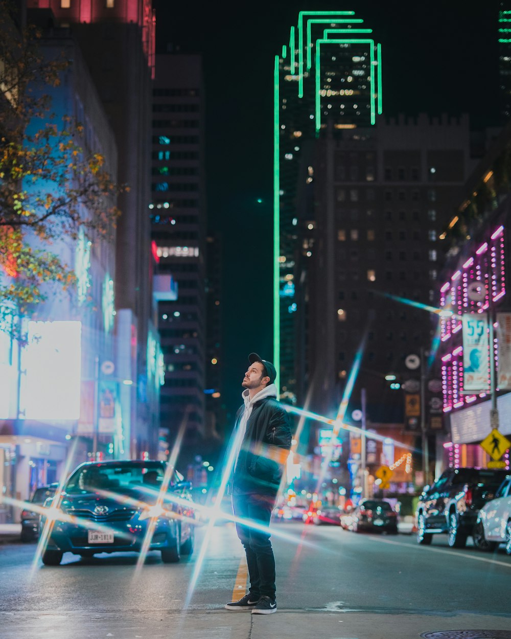 people walking on street during night time