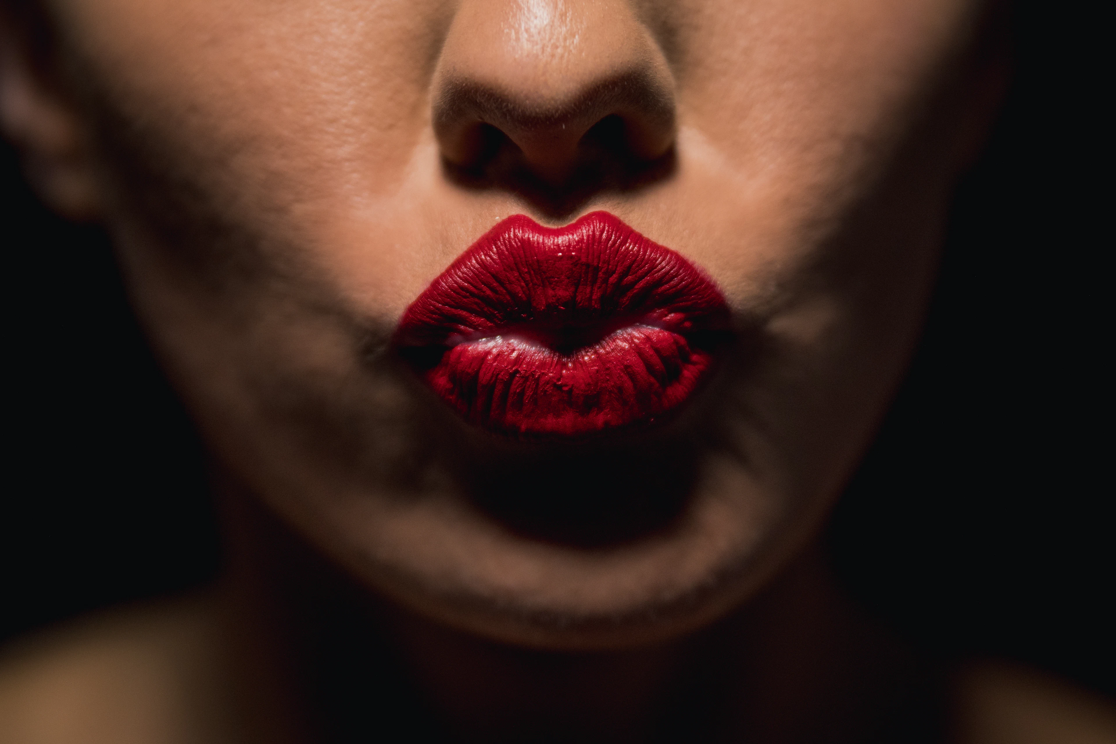 Close-up of full lips in a deep red tone