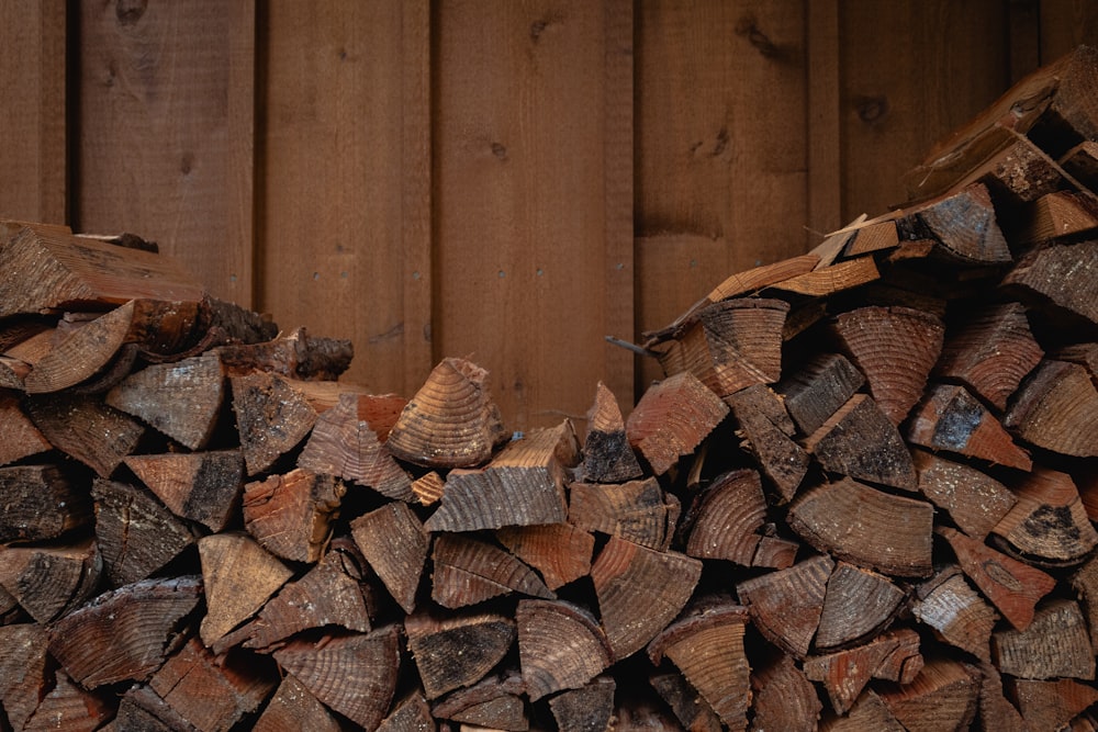 brown wooden log stack on brown wooden surface