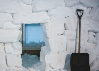 black shovel on white snow