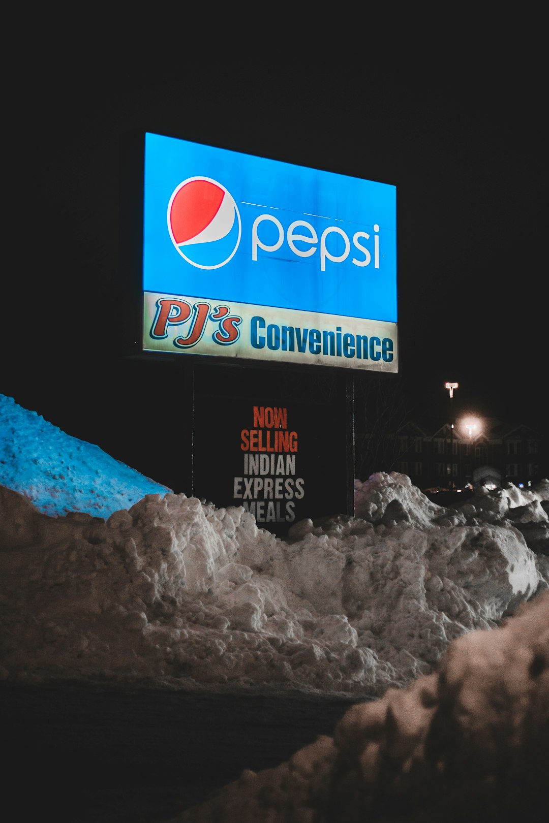 pepsi cola signage during night time