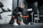 woman in black long sleeve shirt and black pants sitting on exercise equipment