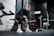 woman in black long sleeve shirt and black pants sitting on exercise equipment