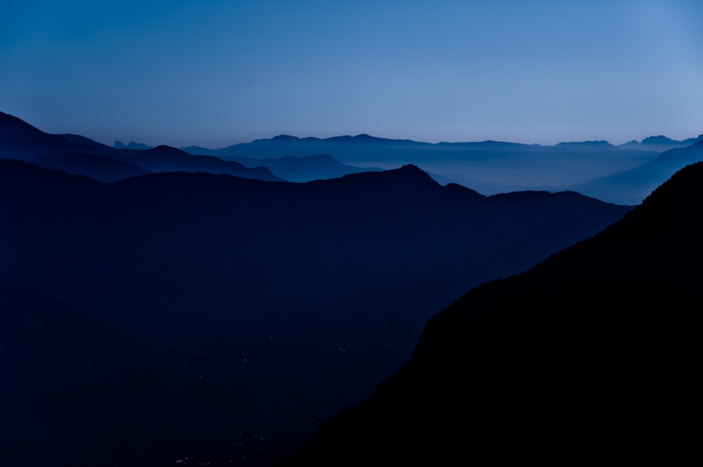 silhouette of mountains during sunset