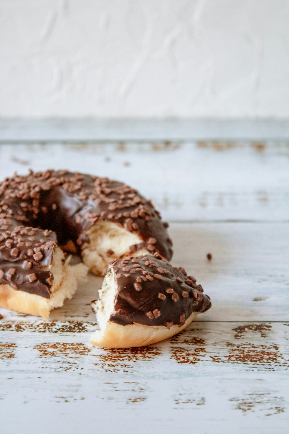 brown and white doughnut on white paper