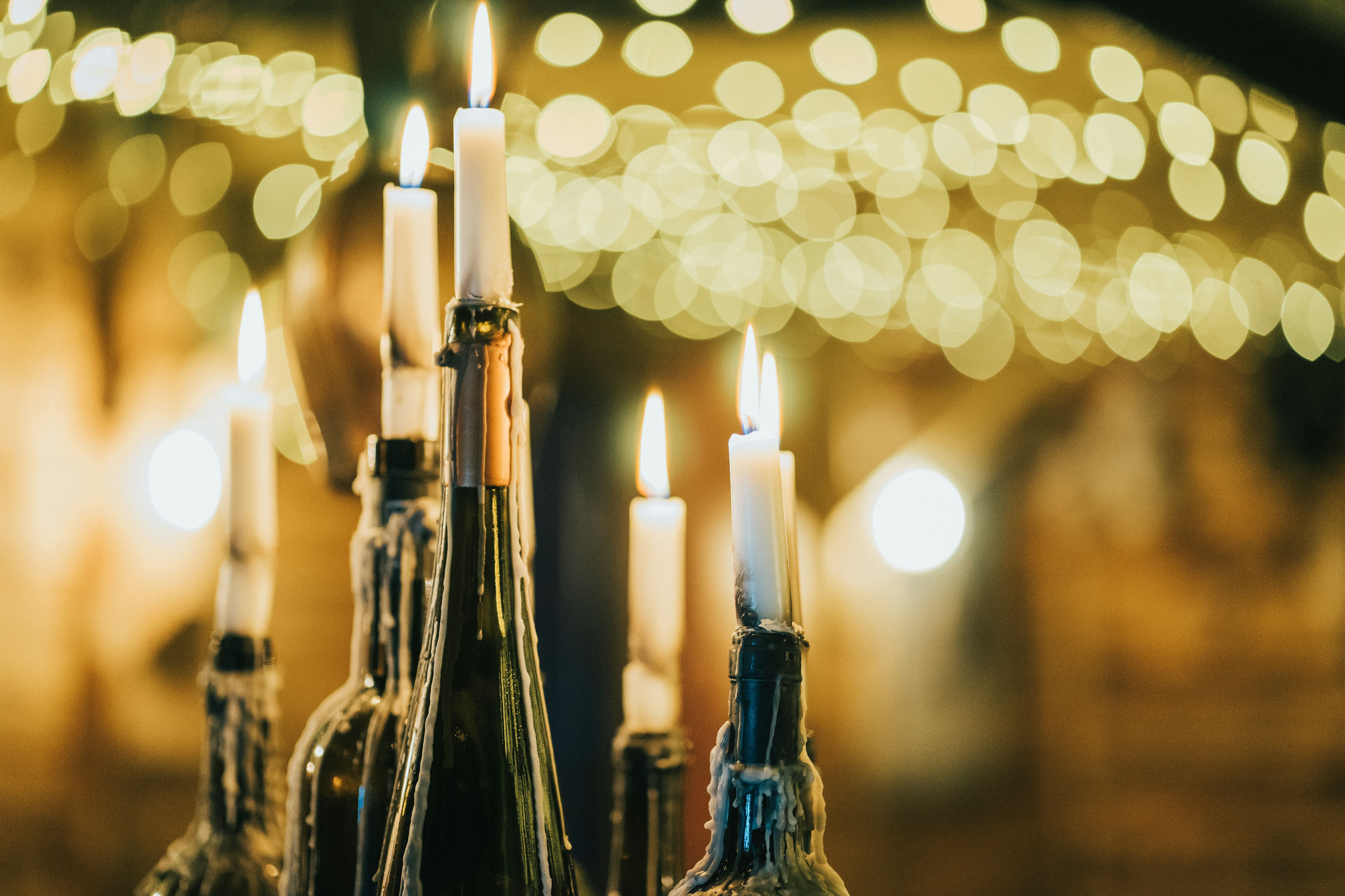Candlelit wine bottles evoking the 400-year-old cellars beneath the hotel