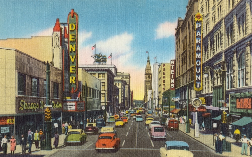 cars on road between high rise buildings during daytime