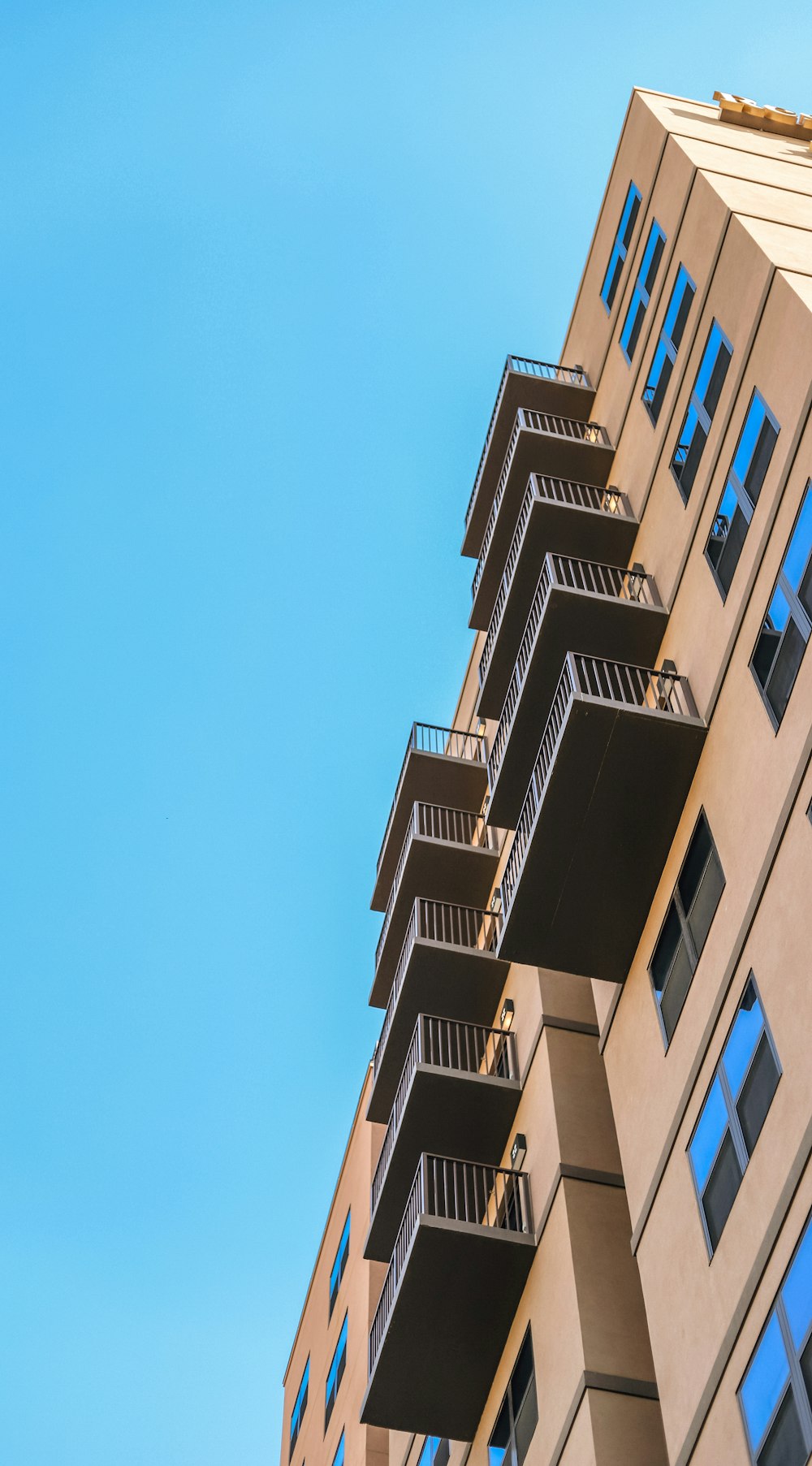 brown concrete building under blue sky during daytime