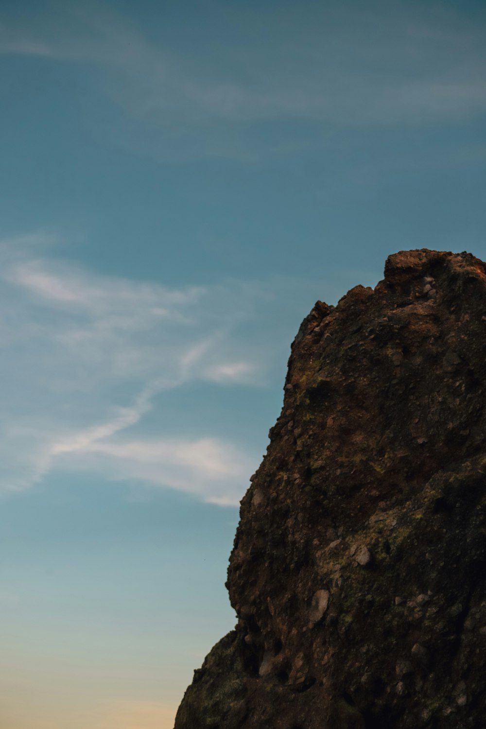 brown rock formation under blue sky during daytime