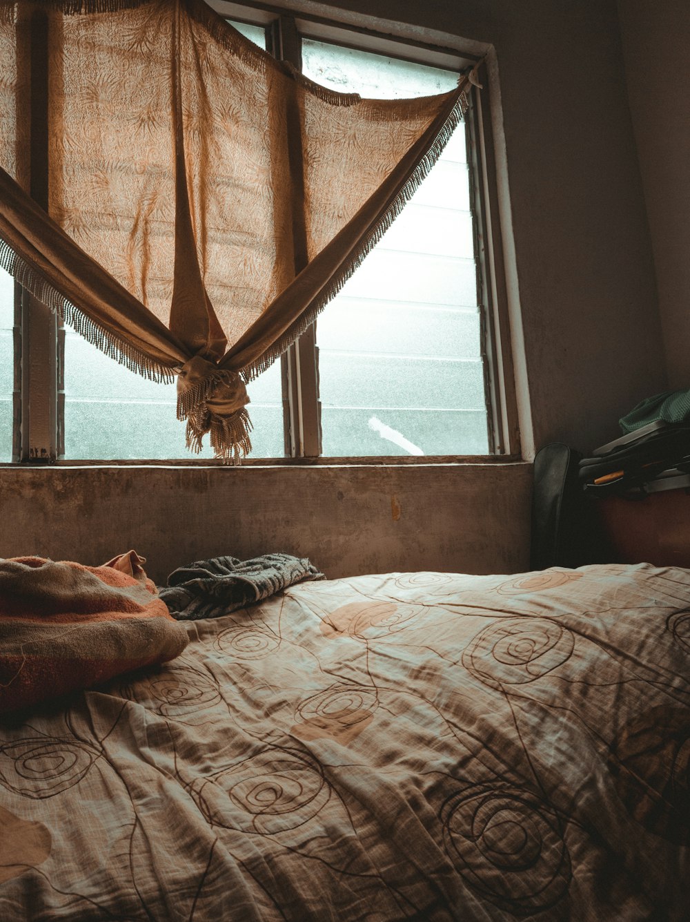 brown and white floral bed linen