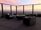 A cozy seating area with a view of the city skyline.