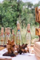 clear glass bottle on brown wooden rack